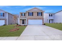 Two-story house with attached garage and landscaping at 3032 Ora Smith Rd, Lincolnton, NC 28092