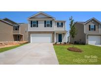 Charming two-story home featuring a two-car garage and well-maintained lawn in a suburban neighborhood at 3032 Ora Smith Rd, Lincolnton, NC 28092