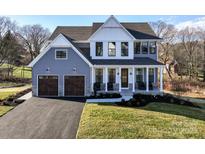 Two story home with gray siding, white accents, and a two car garage at Lot 1 Mayes Meadow Dr # Magnolia, Cornelius, NC 28078