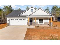 Craftsman style home with gray siding, stone accents, and a two-car garage at 1135 Rudder Cir, Salisbury, NC 28146