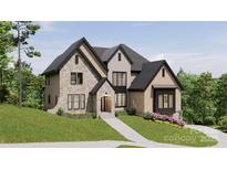 Two-story house with stone and brick accents, a large front yard, and a walkway leading to the entrance at 1312A Reflection Pointe Blvd # 331, Belmont, NC 28012