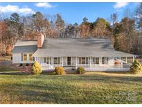 Ranch home with wraparound porch and landscaped yard at 1360 Hopewell Church Rd, Catawba, NC 28609