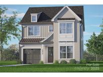 Two-story house with gray siding, dark garage door, and a well-manicured lawn at 1912 St John St, Charlotte, NC 28216