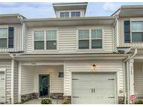 Two-story townhome with modern exterior and attached garage at 3758 Yorkshire Pl, Terrell, NC 28682