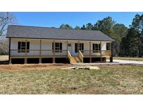 Charming single-story home with a welcoming front porch and black shutters at 4262 Williamson Rd, Rock Hill, SC 29730