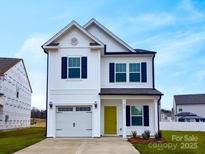 Two-story house with white siding, green door, and attached garage at 813 Gondola Ct # 107, Salisbury, NC 28144