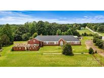 Aerial view of a large brick building on a plot of land at 1318 Ostwalt Amity Rd, Cleveland, NC 27013