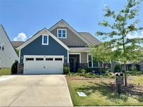 Charming two-story home featuring a spacious garage, beautiful landscaping and Craftsman-style architecture at 16812 Lookout Landing Ln, Charlotte, NC 28278