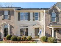 Brick front exterior of charming townhome with well-manicured landscaping at 3047 Misty Harbor Cir # B, Cramerton, NC 28032