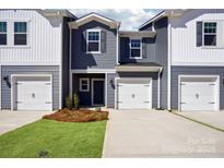 Charming townhouse with a well-manicured lawn, attached garage, and modern siding at 3500 Backwater St, Concord, NC 28027