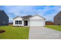 Charming single-story home featuring a two-car garage and well-manicured lawn at 4614 Harris Elliot Rd, Lincolnton, NC 28092