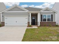 Charming single-story home featuring a two-car garage, stylish gray siding, and a welcoming front porch at 4614 Harris Elliot Rd, Lincolnton, NC 28092