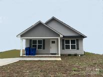 Gray house with white trim, and a small front porch at 53 Soloman St, Wadesboro, NC 28170