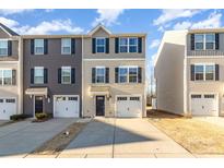 Inviting townhome showcasing two-story design, private garage and neutral color scheme at 828 Renee Ave, Fort Mill, SC 29715