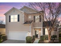 Charming two-story home with a well-manicured lawn and attached garage at 9377 Meadowmont View Dr, Charlotte, NC 28269