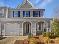 Two-story townhome with blue shutters and arched entryway at 14602 Lions Paw St, Charlotte, NC 28273