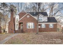 Two-story brick home with a charming front porch and walkway at 2000 Shannon Bridge Ln, Matthews, NC 28105