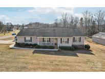 Ranch style house with a spacious yard and mature trees at 2720 Hill Top Dr, Salisbury, NC 28147