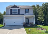 Two-story house with gray siding, a two-car garage, and a landscaped lawn at 1524 Doran Ter, Richburg, SC 29729