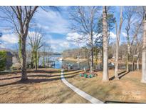 Lakefront property with a relaxing seating area and walkway at 604 Beaten Path Rd, Mooresville, NC 28117