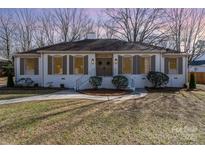 Charming single-story home with a well-maintained front yard and classic architectural details at 2100 Knickerbocker Dr, Charlotte, NC 28212