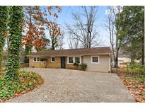 Brick ranch home with gravel driveway, offering curb appeal at 2209 Donnabrook Ln, Gastonia, NC 28052