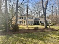 Traditional two story home with a green lawn and black shutters at 3153 Wimbledon Ln, Rock Hill, SC 29732