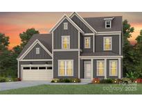 Two-story home with gray siding, beige accents, and a two-car garage at 3527 Rapport Ct # 025, Lancaster, SC 29720