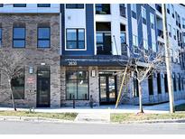 Modern apartment building with brick and blue accents at 3630 N Davidson St, Charlotte, NC 28205