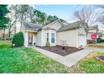 Charming home with well-manicured lawn, tidy landscaping, and a welcoming entrance at 4918 Sunset Ridge Ct, Charlotte, NC 28269