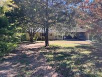 Ranch style home with covered porch and mature trees at 6862 Royal Heights Cir, Hickory, NC 28602