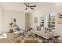 Bright living room featuring a comfortable sofa and neutral color palette at 7504 Surry Ln, Indian Trail, NC 28079