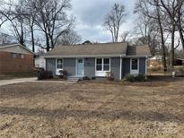 Newly renovated ranch home featuring a gray exterior and updated landscaping at 757 Bilmark Ave, Charlotte, NC 28213