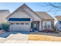 Curb appeal abounds in this charming house with a welcoming front porch at 975 Shorthill Ln, Fort Mill, SC 29715