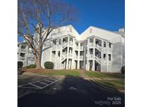 White two-story building with multiple entrances and parking at 15 Hamiltons Bay Ct # A939, Lake Wylie, SC 29710