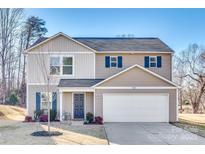 Two-story house with neutral siding, a two-car garage, and landscaping at 1529 Cannan Mountain Dr, Newton, NC 28658