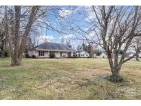 Ranch home with mature trees and a spacious lawn at 3219 Monte Dr, Monroe, NC 28110