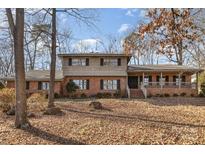 Brick house with a large backyard and mature trees at 1308 Gum Branch Rd, Charlotte, NC 28214