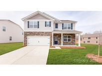 Two-story house with stone accents, a white garage door, and a neatly landscaped lawn at 4626 Harris Elliot Rd, Lincolnton, NC 28092