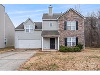 Two-story house with stone accents and a two-car garage at 5851 Brookfield Pointe Dr, Charlotte, NC 28216