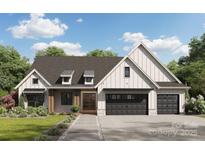 Craftsman style home with gray siding, stone accents, and a two-car garage at 188 Heartland Dr # 23, Rock Hill, SC 29732