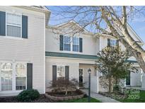 Inviting exterior of a charming townhome with landscaping at 4211 Center Place Dr, Harrisburg, NC 28075