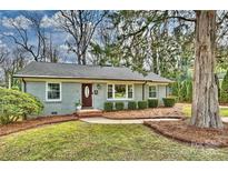 Charming ranch home with brick facade and manicured landscaping at 4237 Darwin Cir, Charlotte, NC 28209