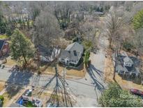 An aerial view of a charming home featuring mature trees and a well-maintained yard in a quiet neighborhood at 531 Elm St, Salisbury, NC 28144