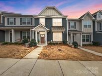 Charming townhouse with a welcoming entrance and well-manicured landscaping at 1108 Township Pkwy, Belmont, NC 28012