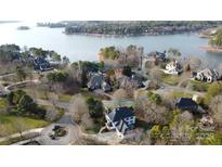 Stunning aerial view of lakefront home with mature trees and circular driveway at 115 Union Chapel Dr # 549, Mooresville, NC 28117