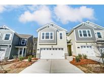 Charming exterior featuring a white garage door, neutral siding, and well-manicured landscaping at 260 Laura Elizabeth Ln, Clover, SC 29710