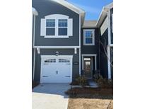 Modern two-story townhome with gray siding, white garage door, and landscaping at 280 Laura Elizabeth Ln, Clover, SC 29710