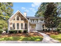 Gray house with stone accents and double doors, nicely landscaped at 3013 Southampton Cir, Gastonia, NC 28056