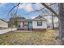 Charming single-story home with a cozy front porch and well-maintained lawn at 776 Washington Ln, Kannapolis, NC 28083